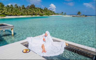 Guest Relaxing in the Sundeck of the Overwater Villa