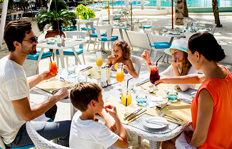 Family Enjoying Dining with Holiday Inn Resort Kandooma Maldives
