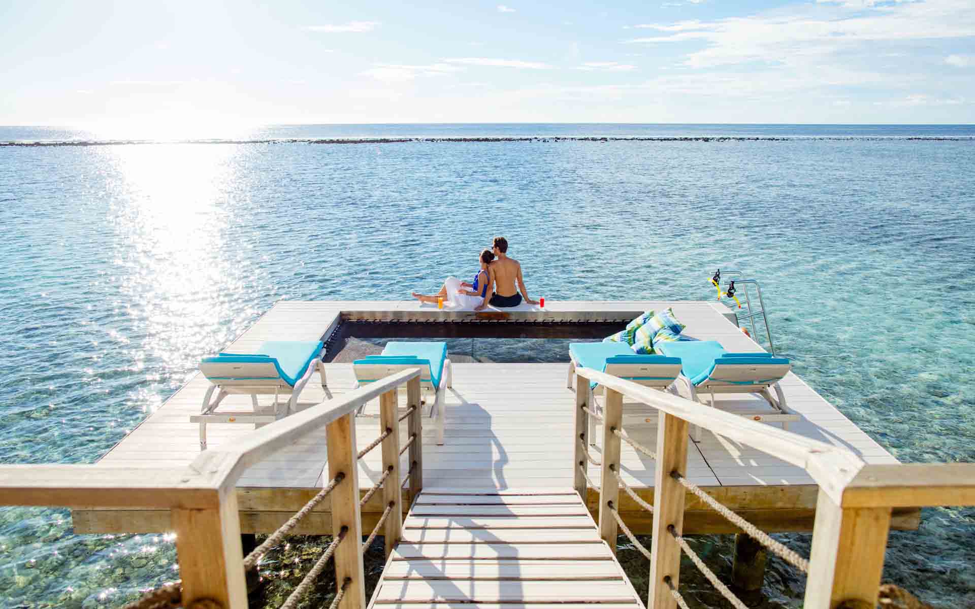 Guests Enjoying the Sea View from the Overwater villa