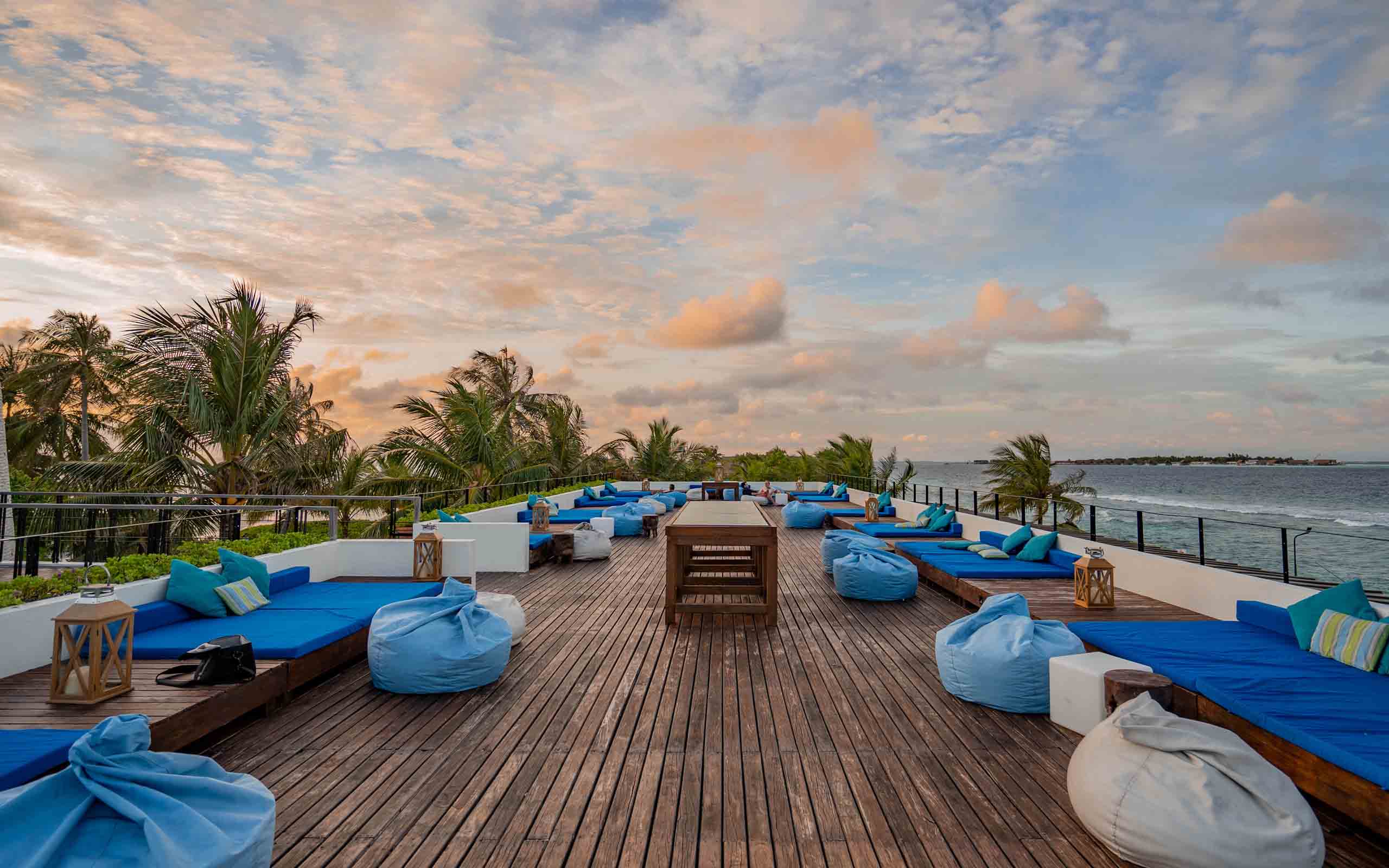 Holiday Inn Resorts Maldives Guests Enjoying in an Overwater Villa